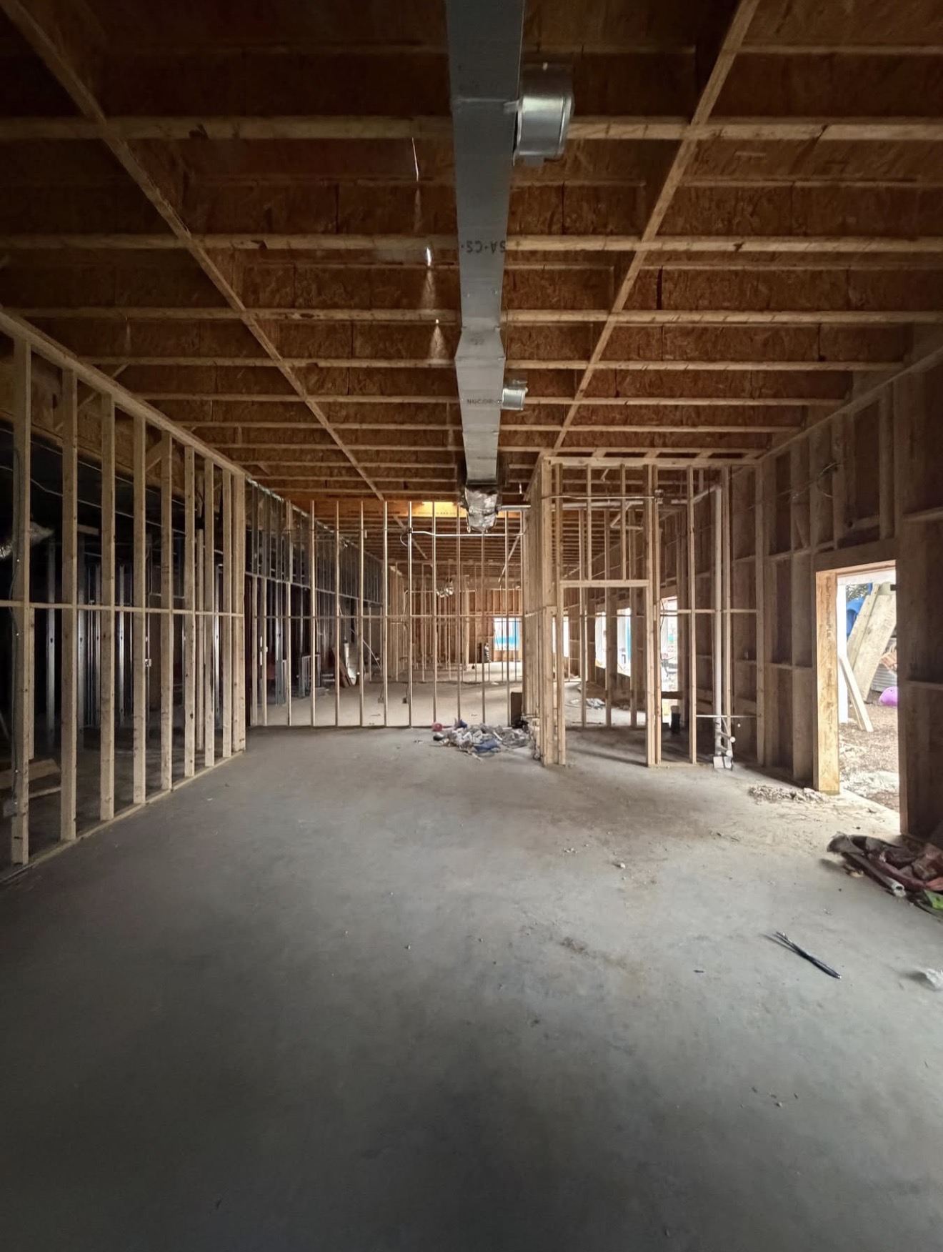 Wood framing and ductwork at a Sosa Prime construction site